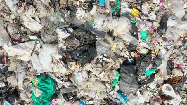 Plastic pollution environmental problem. A landfill in Southeast Asia filled with trash which is not recycled. Aerial drone video
