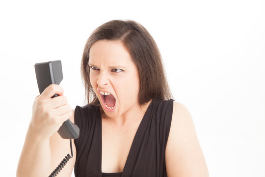 yelling down office phone at difficult customer