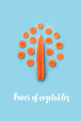 Carrot in the form of a tree on a blue background. Conceptual photo of carrots. Vegetarian food
