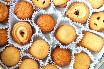 An overhead or flat lay view of Danish butter cookies in the traditional tin box. valentines day gift. with copy space