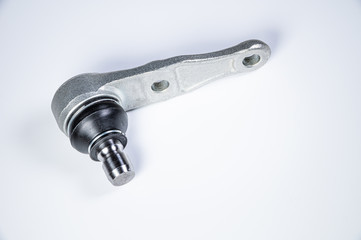 New spare parts spherical ball joints of a suspension bracket of a car on a gray background