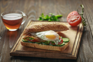 CloseUp delicious sandwich on a cutting board.
