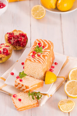 Lemon sponge cake with pomegranate.