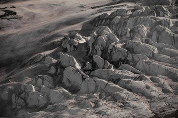 Mountain hills with the dirty snow remnants