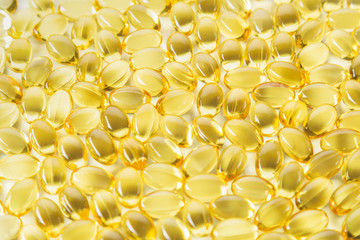 close up view, evening primrose oil capsules. Alternative medicine and health care concept.