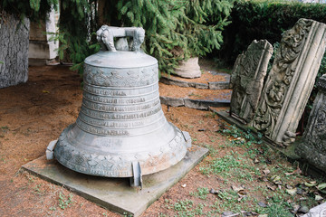 Obraz premium Bucharest, Romania - Dec 14, 2019: big bronze church bell situated in the courtyard of Church 