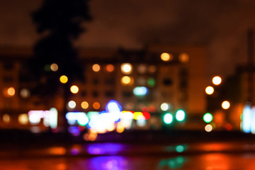 Fototapeta na wymiar Street city lights out of focus at night, bokeh