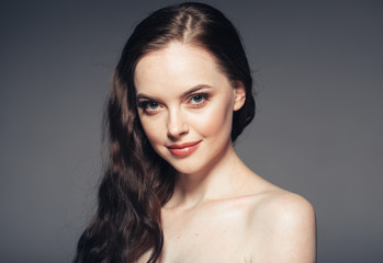 Fototapeta premium Beauty woman face natural make up long brunette hair female