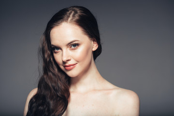 Naklejka premium Beauty woman face natural make up long brunette hair female