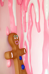 gingerbread man on the background of a wall covered with glaze