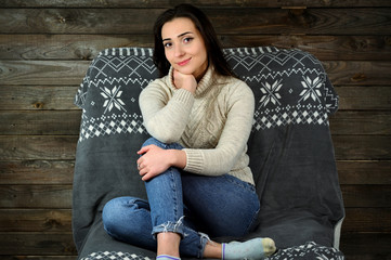 Concept girl in the home interior. Portrait of a lovely pretty young brunette woman in a white...