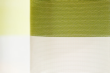 The texture of the fabric curtains hanging on the window. Background for fabric.