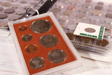 Many coins of different countries and times. Numismatics