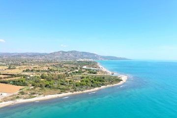 Alcossebre, Costa Del Azahar, Valencian Community, Spain. Beautiful unique drone shot of the spanish mediterranean sea coast. Cristal sunny summer day. Colorful landscape, turquoise water. 