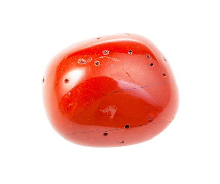polished red coral gemstone isolated on white