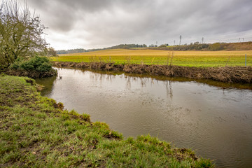 Stretch of the River Tas from the bank of the ancient Roman camp in Caistor St Edmond in Norfolk