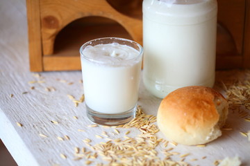 Milk in a jar and rolls