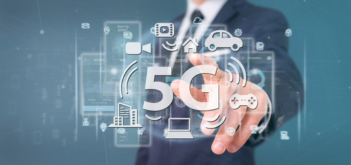 Fototapeta na wymiar Businessman holding a 5G connection with data surrounding - 3d rendering