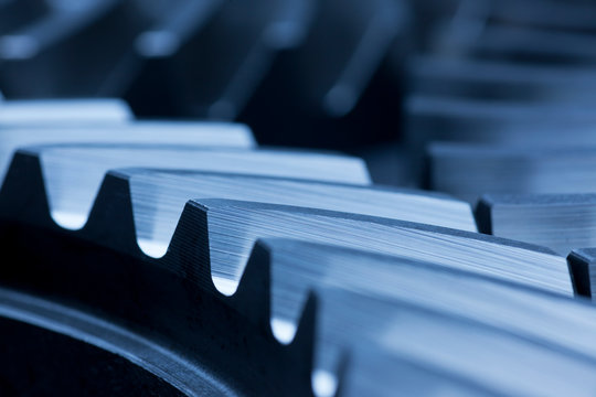 Three cog wheels working together in an engine