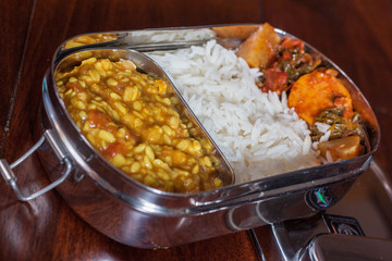 Indian tiffin, the lunch box with basic dal, rice and sabzi