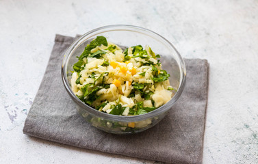 Fresh cabbage salad with spinach and sweet corn. Vegan healthy food