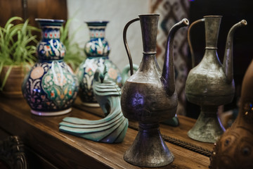 Ancient copper decanter and clay jug.