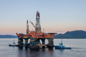 Anchor handling operation with oil rig West Alpha in the fjord of Norway. Norway Ølen September...