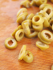 green olives on a wooden board