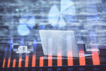 Forex Chart hologram on table with computer background. Double exposure. Concept of financial markets.