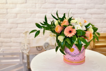 Sweet flower arrangement for Valentine's day. A fragrant bouquet of flowers on a white table.