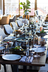 Fototapeta na wymiar Served dinner table in a beautiful, expensive restaurant