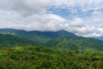beautiful blue sky high peak mountains mist fog wildlife green forest at Khao Koh, Phu Tub Berk, Phetchabun, Thailand  guiding idea long weekend for backpacker camping campfire relaxing hiking
