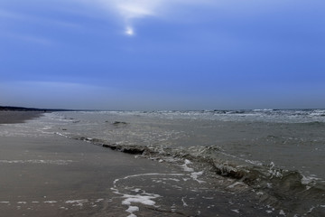 Fototapeta na wymiar Gray Baltic sea and blue sky.