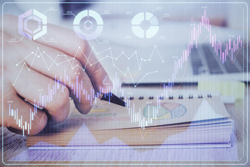 Multi exposure closeup hands with stock market forex graph.
