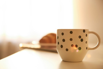 Cup of hot drink on table, space for text. Lazy morning