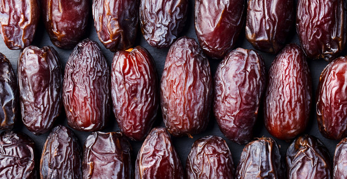 Fresh Medjool Dates background. Healthy organic product. Top view. Close up.