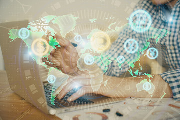 Multi exposure of forex graph with man working on computer on background. Concept of market analysis.