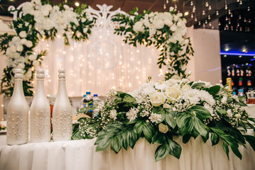 Romantic flower arrangement on the festive table