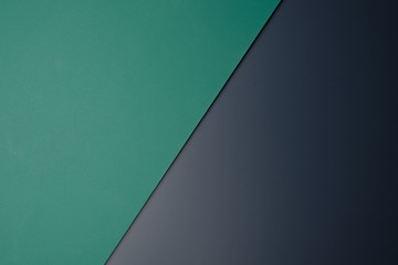 Green paper on black table color for background color.