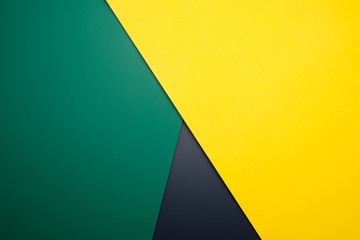 Triple color of Yellow, green and black crossing each other for background color.