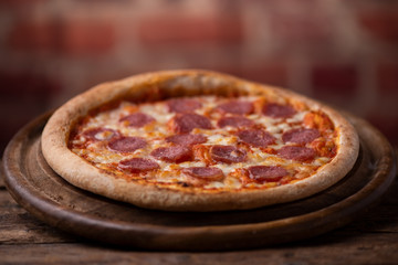 Pepperoni Pizza on wooden table
