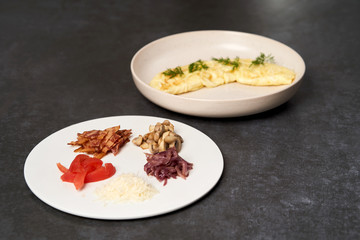 Traditional breakfast omelette with bacon, tomatoes, mushrooms, onion