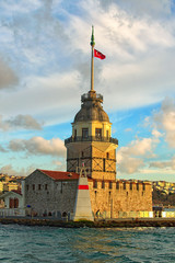 Close-up view of medieval Maiden's Tower (also called Leander's Tower or Tower of Leandros) against cloudy sky. Sunny winter day in Istanbul, Turkey. Travel and tourism concept