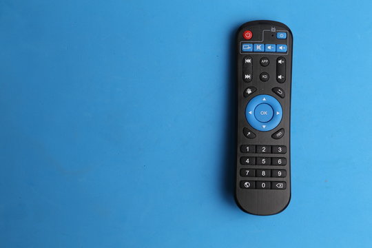 TV remote control in color background