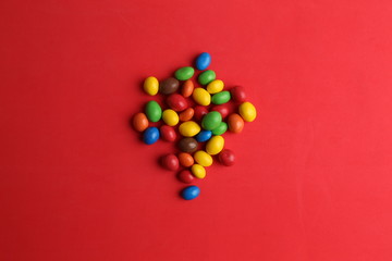 Obraz premium delicious colorful chocolate balls stuffed with peanut