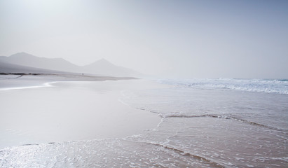Beach landscape -  Cofete, Fuerteventura, Canary Islands. Perfect place for the coast lovers. Tourist holiday destination, background, copy space.