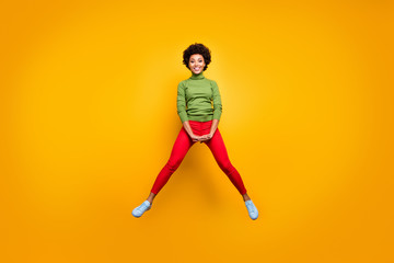 Fototapeta na wymiar Full length body size view of her she nice attractive lovely cheerful cheery wavy-haired girl jumping having fun fooling isolated over bright vivid shine vibrant yellow color background