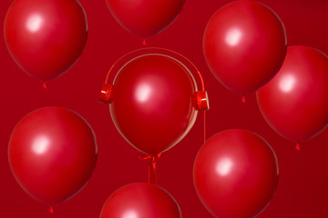 red helium balloons  with a balloon in red retro headphones