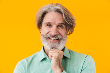 Happy elderly grey-haired bearded man