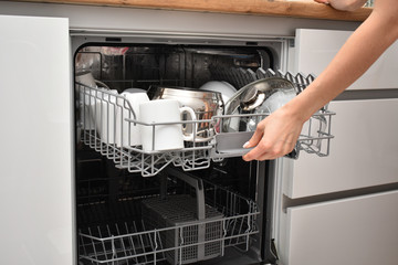 Clean dishes in a dishwasher